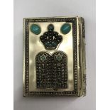 UNMARKED WHITE METAL ENCASED PSALMS BOOK DECORATED WITH CABOCHON STONES AND JUDAICA SYMBOLS