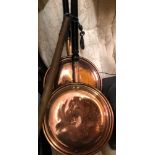 TWO ANTIQUE COPPER WARMING PANS AND A FLAIL STICK