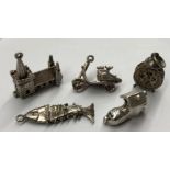 BAG OF FIVE SILVER BRACELET CHARMS, A CHURCH, MOPED,