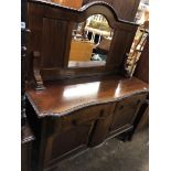 MAHOGANY MIRROR BACKED SERPENTINE SIDEBOARD