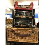 THREE JAGUAR MODEL BURAGO DIECAST CARS AND A WICKER BASKET