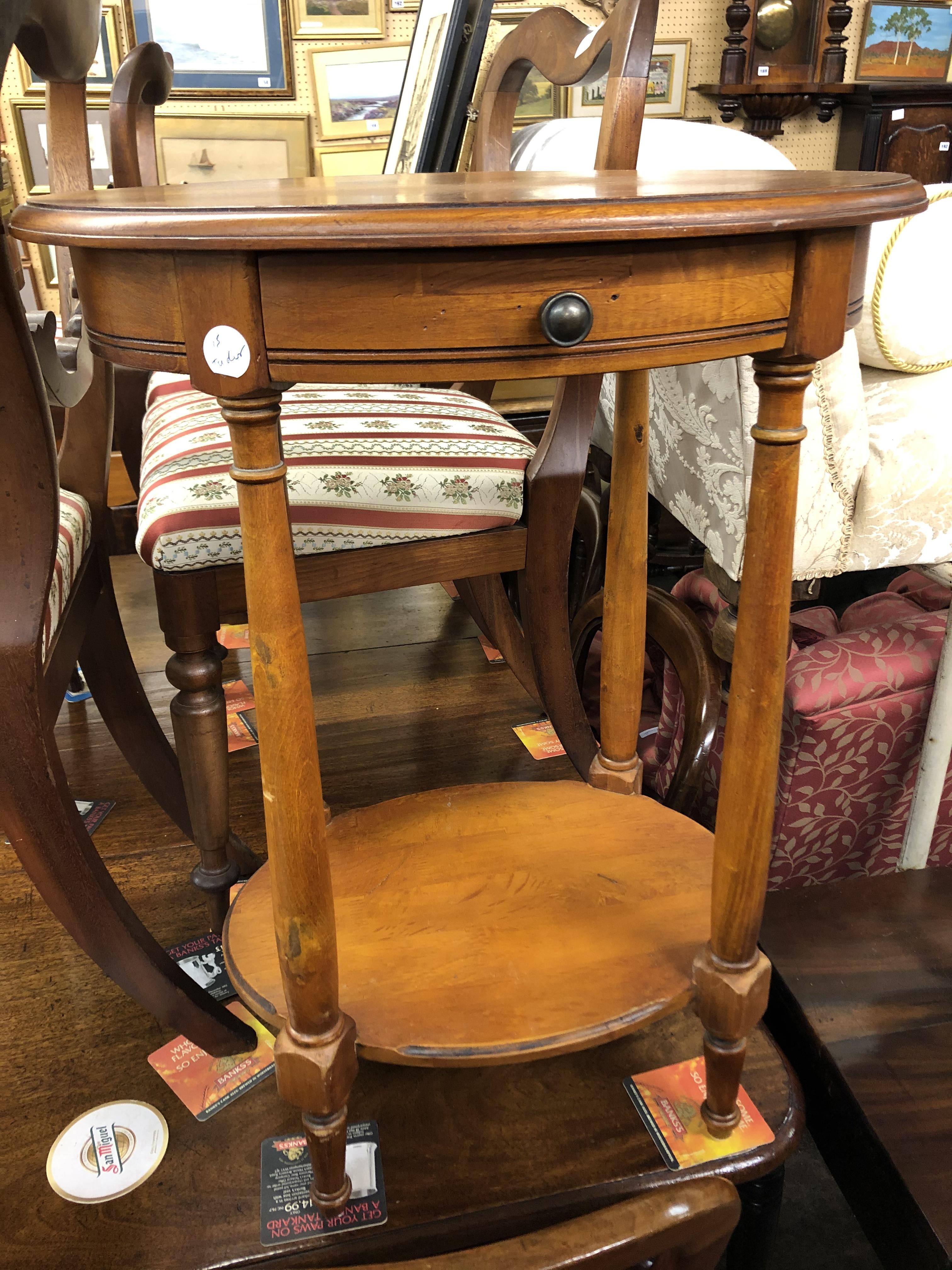 OVAL OCCASIONAL TABLE WITH SHALLOW DRAWER AND UNDERTIER