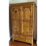 PINE VICTORIAN STYLE TWO DOOR WARDROBE FITTED WITH THREE DRAWERS TO THE BASE