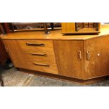 1970S G PLAN TEAK LOW SIDEBOARD WITH CANTED END CUPBOARDS
