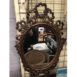 OVAL MIRROR IN FLORAL ORNATE FRAME