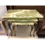 NEST OF THREE SIMULATED ONYX AND GILT CABRIOLE LEG TABLES