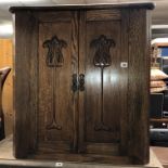 OAK TWO DOOR CARVED CABINET