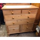 PINE GALLERY BACKED TWO OVER TWO DRAWER CHEST WITH CUPBOARD DOORS BELOW