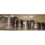 SHELF OF ANTIQUE PEWTER LIDDED TANKARDS,