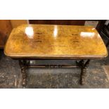 VICTORIAN WALNUT AND MARQUETRY INLAID SWIVEL TOP CENTRE TABLE ON TRESTLE END POLE STRETCHER BASE