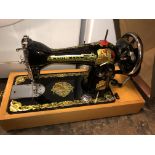 CASED SEWING MACHINE