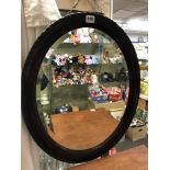 SIMULATED OVAL ROSEWOOD BEVELLED MIRROR