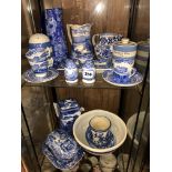 TWO SHELVES OF BLUE AND WHITE TRANSFER PRINTED WARES INCLUDING RINGTONS TEAPOT, COPELAND SPODE,