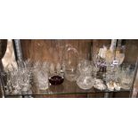 SHELF OF CUT AND ETCHED GLASSWARE