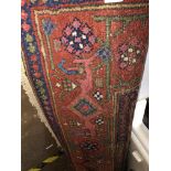 ROLLED RED PATTERNED CAUCASIAN CARPET RUNNER