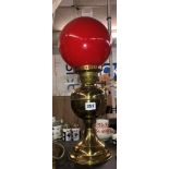 BRASS OIL LAMP WITH RED GLASS SHADE