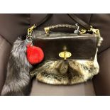 FAUX LEATHER AND FAUX FUR RIVER ISLAND HANDBAG WITH REAL FOX FUR ATTACHMENT AND RED POM,