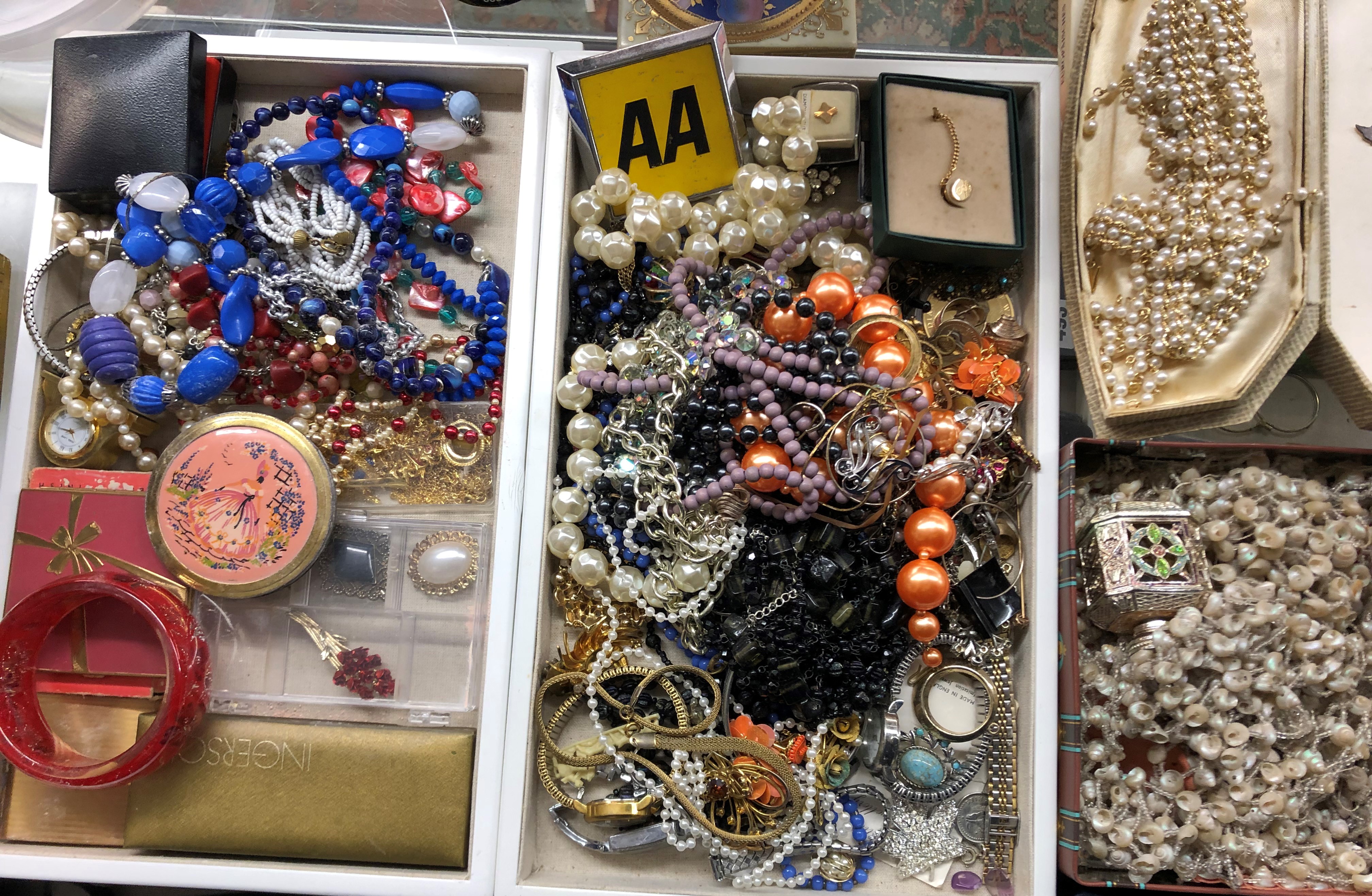 TWO TRAYS OF VARIOUS COSTUME BEADS, POWDER COMPACTS,