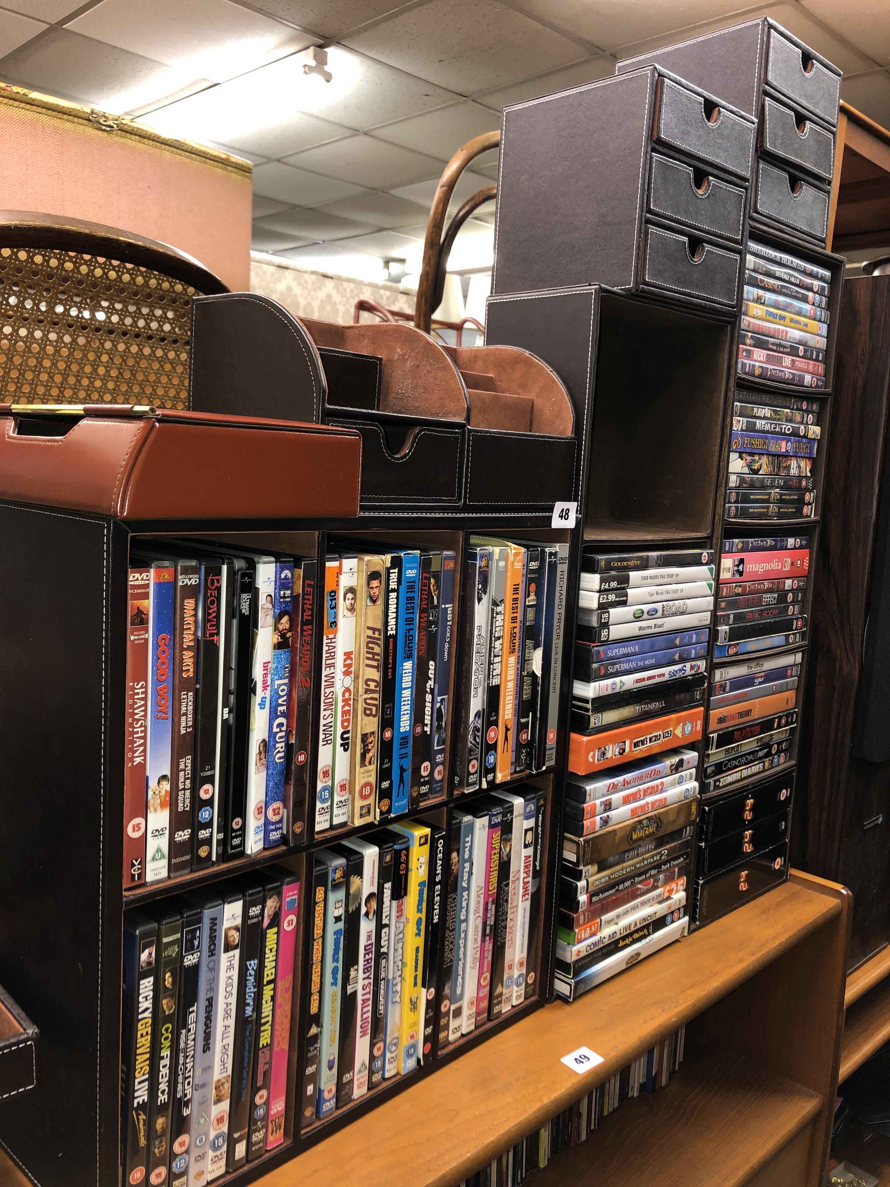 BROWN STITCHED DVD STORAGE RACKS (WITH CONTENTS) AND DESK TIDY