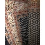 20TH CENTURY WOOLEN FRINGE CARPET WITH PATTERNS ON A BLUE GROUND