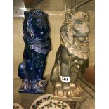 TWO LUSTRE GLAZED SEATED LIONS