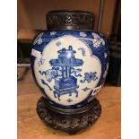 19TH CENTURY CHINESE BLUE AND WHITE OVOID JAR DECORATED WITH PANELS OF ATTRIBUTES WITH A FRET