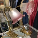 TWO BRASS ADJUSTABLE LAMPS WITH CRANBERRY TINTED SHADES