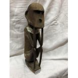 SOLOMON ISLANDS TYPE CARVED SEATED FIGURE
