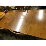 MODERN MAHOGANY EXTENDING DINING TABLE AND SIX SLAT BACK CHAIRS BY JULIEN BOWEN