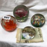 FOUR DECORATIVE PAPERWEIGHTS