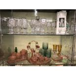 TOP SHELF OF SETS OF DRINKING GLASSES AND THE SECOND SHELF OF COLOURED GLASSWARES