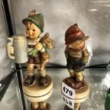 TWO HUMMEL FIGURES OF BAVARIAN BOYS (SLIGHT CHIP TO ONE HAT)