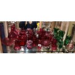 GOOD SHELF OF CRANBERRY GLASSWARE INCLUDING CLARET JUG, BOWLS, SIFTERS,