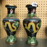 PAIR OF CLOISSONNE ENAMEL BALUSTER VASES DECORATED WITH DRAGONS ON A BLACK GROUND