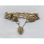 9CT GOLD CROSS LINK FIVE STRAND BRACELET WITH HEART PADLOCK AND SAFETY CHAIN 14.