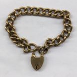 UNMARKED YELLOW METAL HOLLOW BRACELET WITH HEART PADLOCK 13.