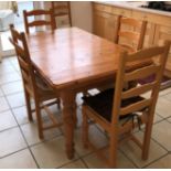 PINE EXTENDING DINING TABLE AND SIX LADDER BACK CHAIRS