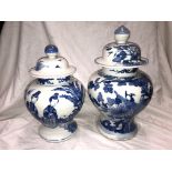 TWO CHINESE BLUE AND WHITE BALUSTER 20TH CENTURY VASES WITH DOME LIDS (LIDS A/F)