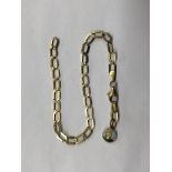 9CT GOLD FLAT CURB LINK BRACELET WITH 9CT GOLD ENAMEL ST CHRISTOPHER CHARM,