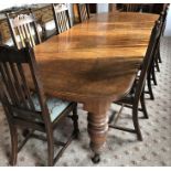 LATE VCTORIAN OAK OVAL ENDED EXTENDING DINING TABLE ON CHUNKY TURNED TAPERED BULBOUS LEGS WITH FOUR