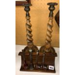 PAIR OF BARLEY TWIST CANDLE STICKS AND A PIPE RACK OF PIPES