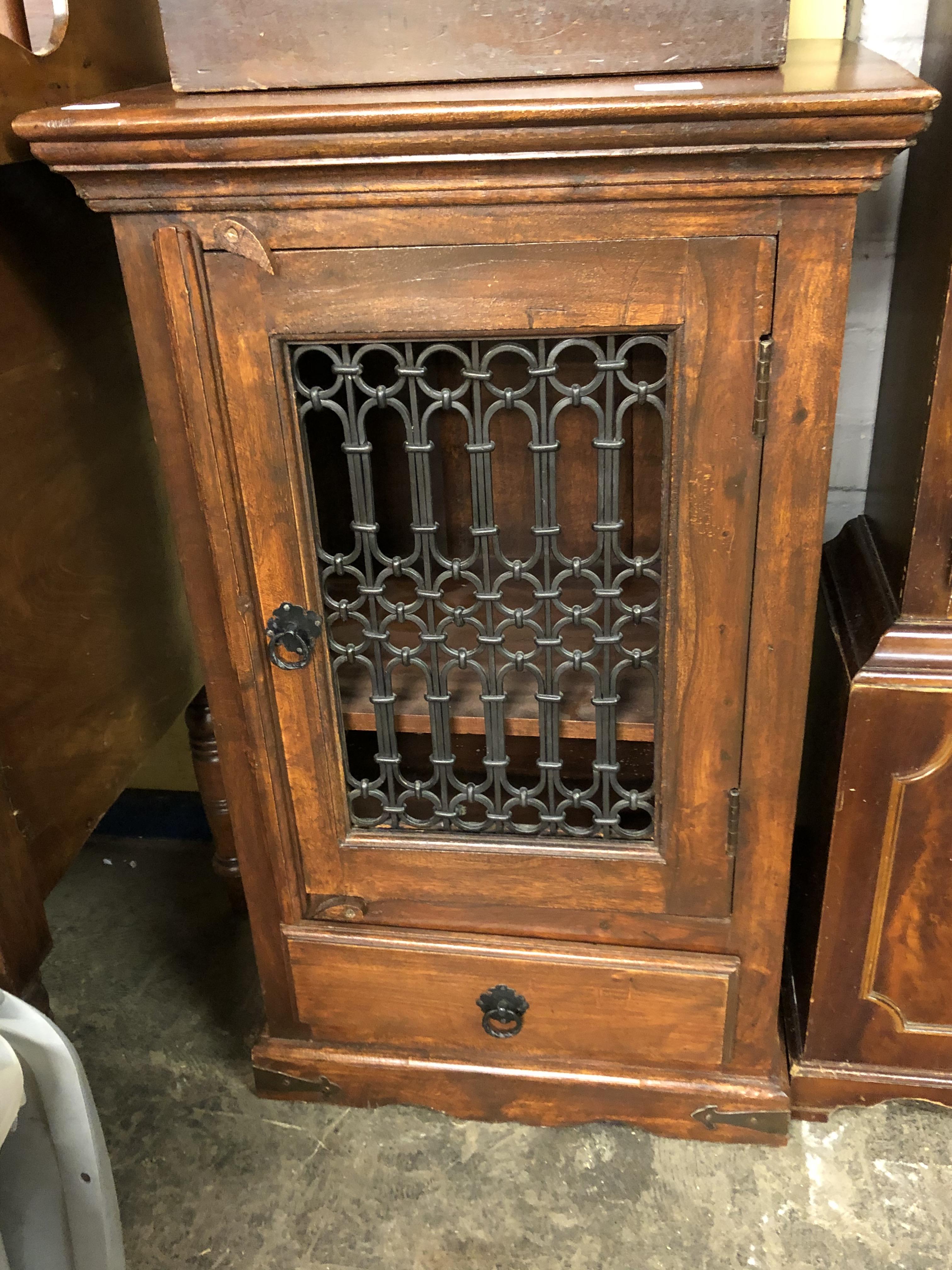 HARDWOOD CABINET WITH WROUGHT IRON FRET PANELLED DOOR