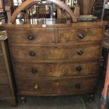 VICTORIAN MAHOGANY VENEERED BOW FRONT TWO OVER THREE DRAWER CHEST ON TURNED FEET