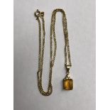 9CT GOLD FLAT CURB CHAIN ON A STAMPED 585 MOUNTED CITRINE PENDANT. OVERALL WEIGHT 6.