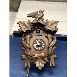 CARVED CUCKOO CLOCK AND A GLOSS PANEL OF AN EASTERN WATER CARRIER