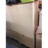 CREAM PANEL TWO DOOR WARDROBE AND MATCHING BEDSIDE CUPBOARD WITH DRAWER