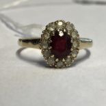 9CT RUBY AND CZ CLUSTER RING SIZE O/P 2.