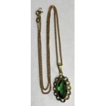 9CT GOLD FLAT CURB LINK CHAIN WITH A PLATED GREEN STONE PENDANT 1.
