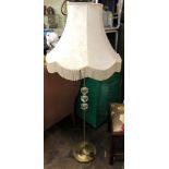 BRASS AND GLASS THREE BALL LAMP STANDARD AND FRINGED SHADE
