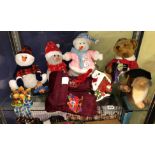 SHELF OF CHRISTMAS RELATED ORNAMENTS AND SOFT TOYS